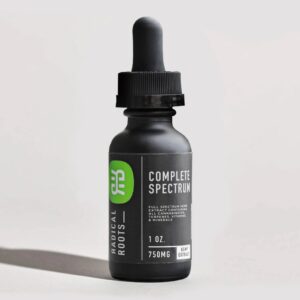 Tincture bottle with light background and shadow