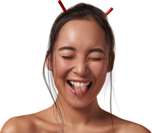 Woman smiling with herbal pill on her tongue
